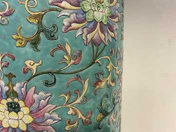 A large Chinese famille rose cylindrical vase with molded lotus scrolls, Jiaqing/Daoguang
